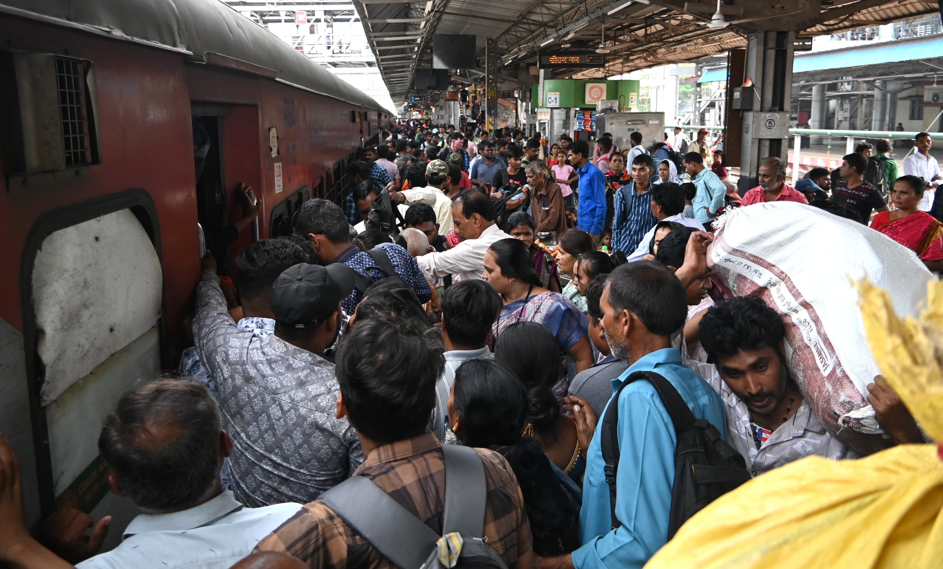 Women were seen waiting for the local train in the station