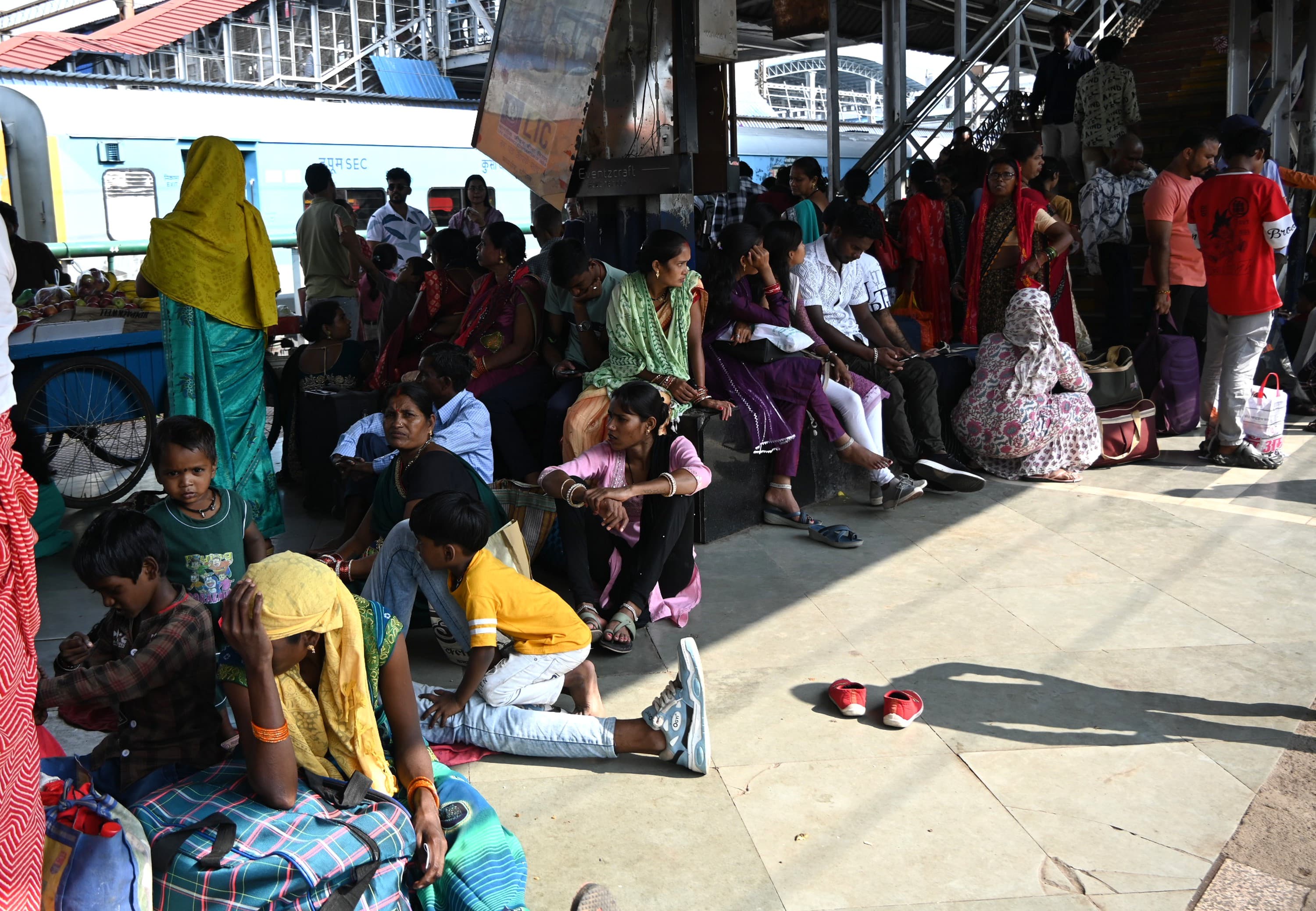 Women were seen waiting for the local train in the station