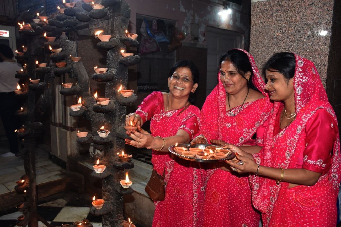 Illuminated temples on Kartik Purnima: Temples and buildings illuminated with lamps on Dev Diwali.