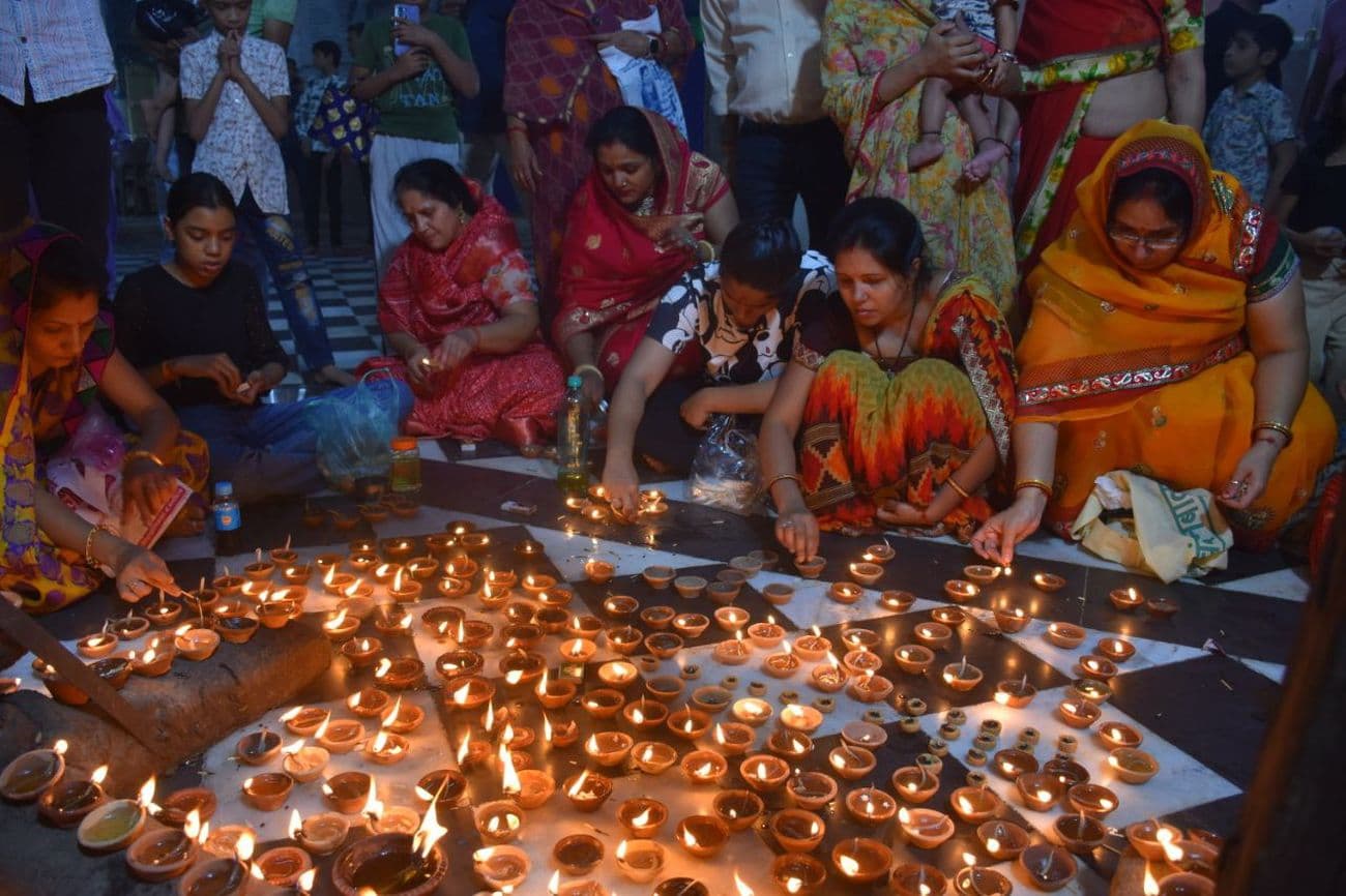 Illuminated temples on Kartik Purnima: Temples and buildings illuminated with lamps on Dev Diwali.