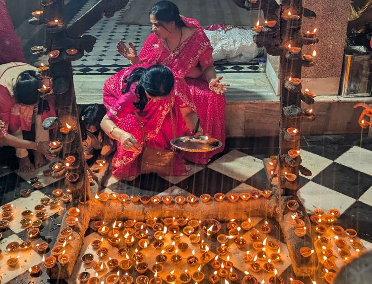 Illuminated temples on Kartik Purnima: Temples and buildings illuminated with lamps on Dev Diwali.