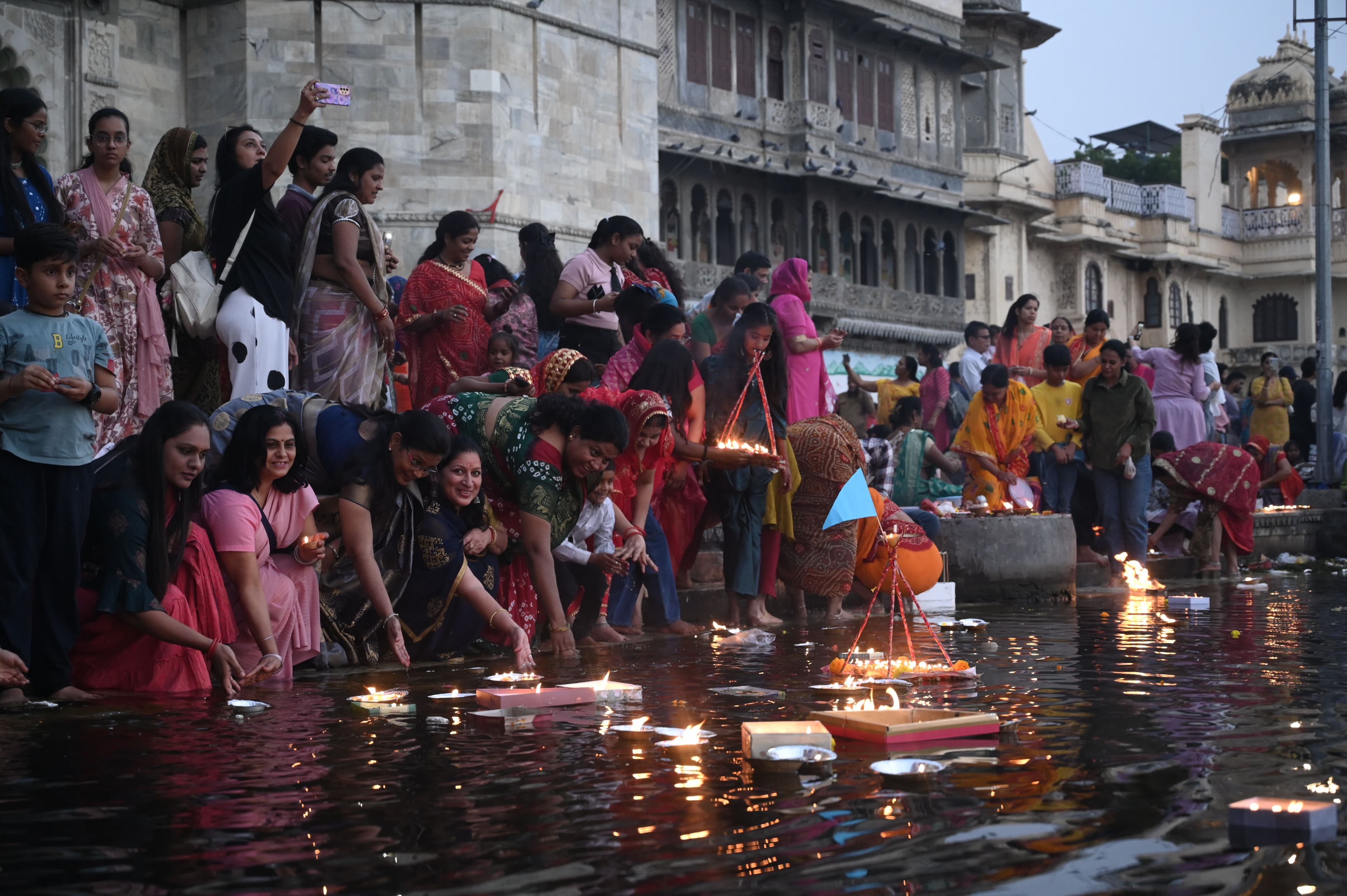 donating lamps in Pichola lake on Kartik Purnima.