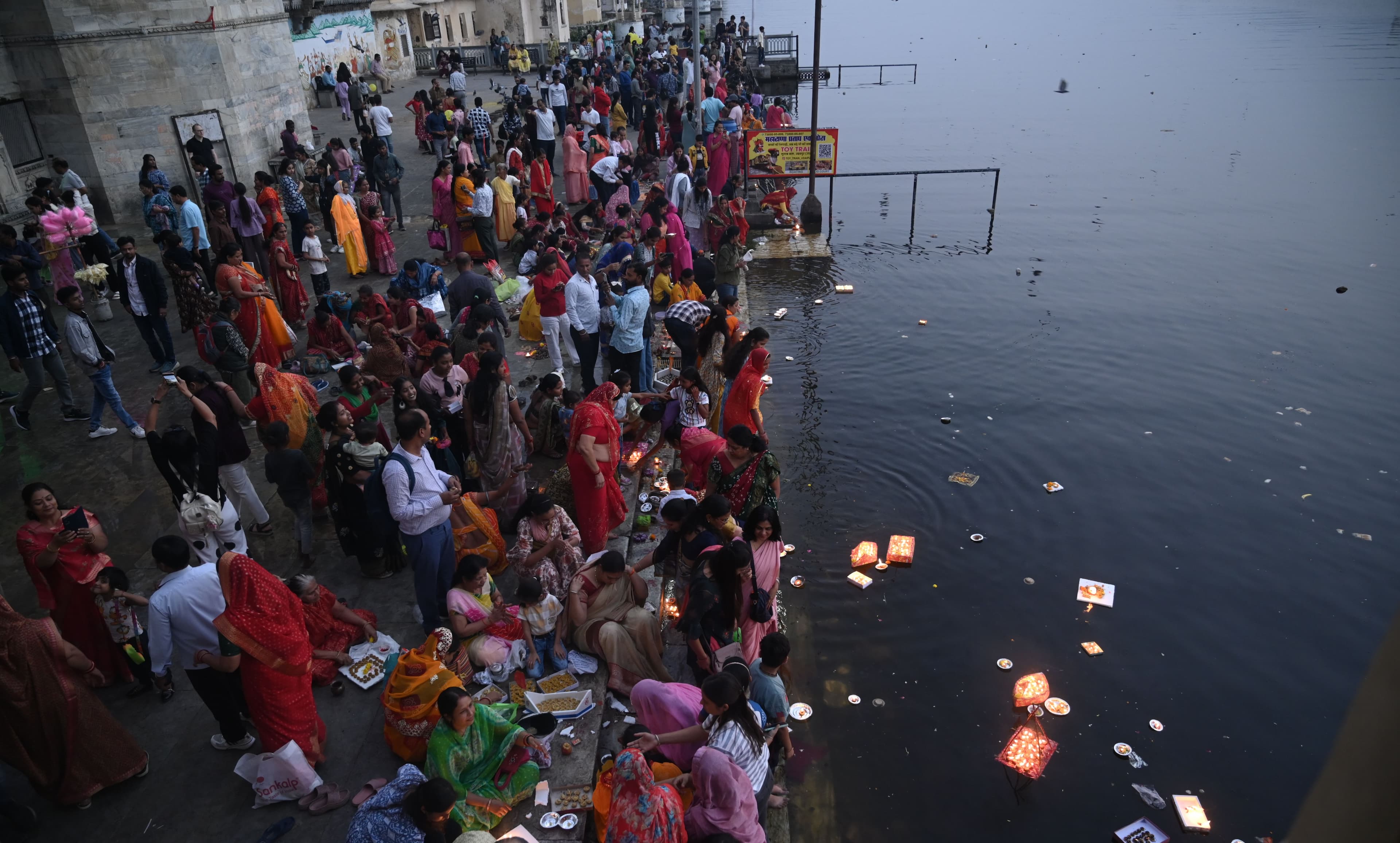 donating lamps in Pichola lake on Kartik Purnima.