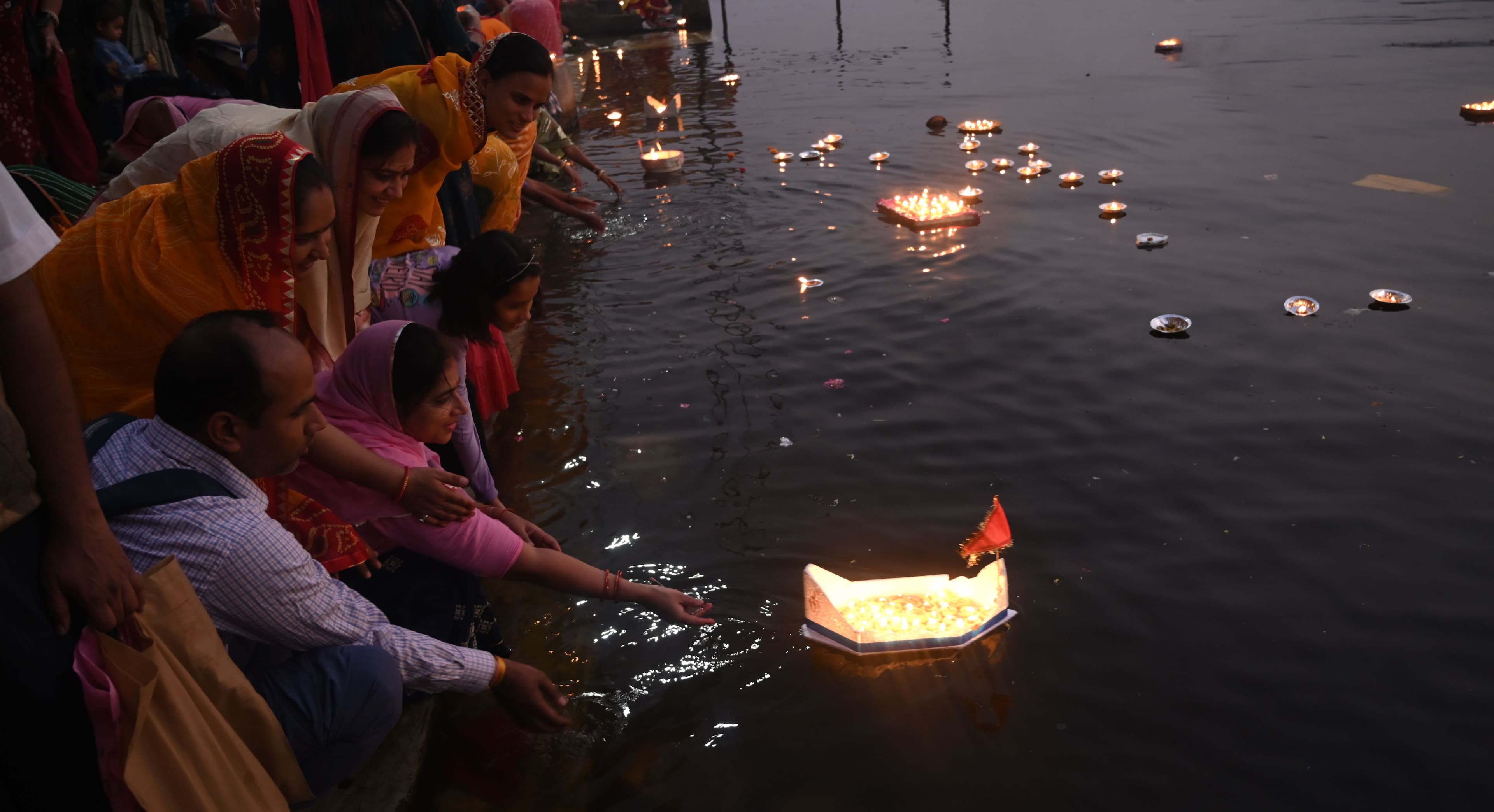 donating lamps in Pichola lake on Kartik Purnima.