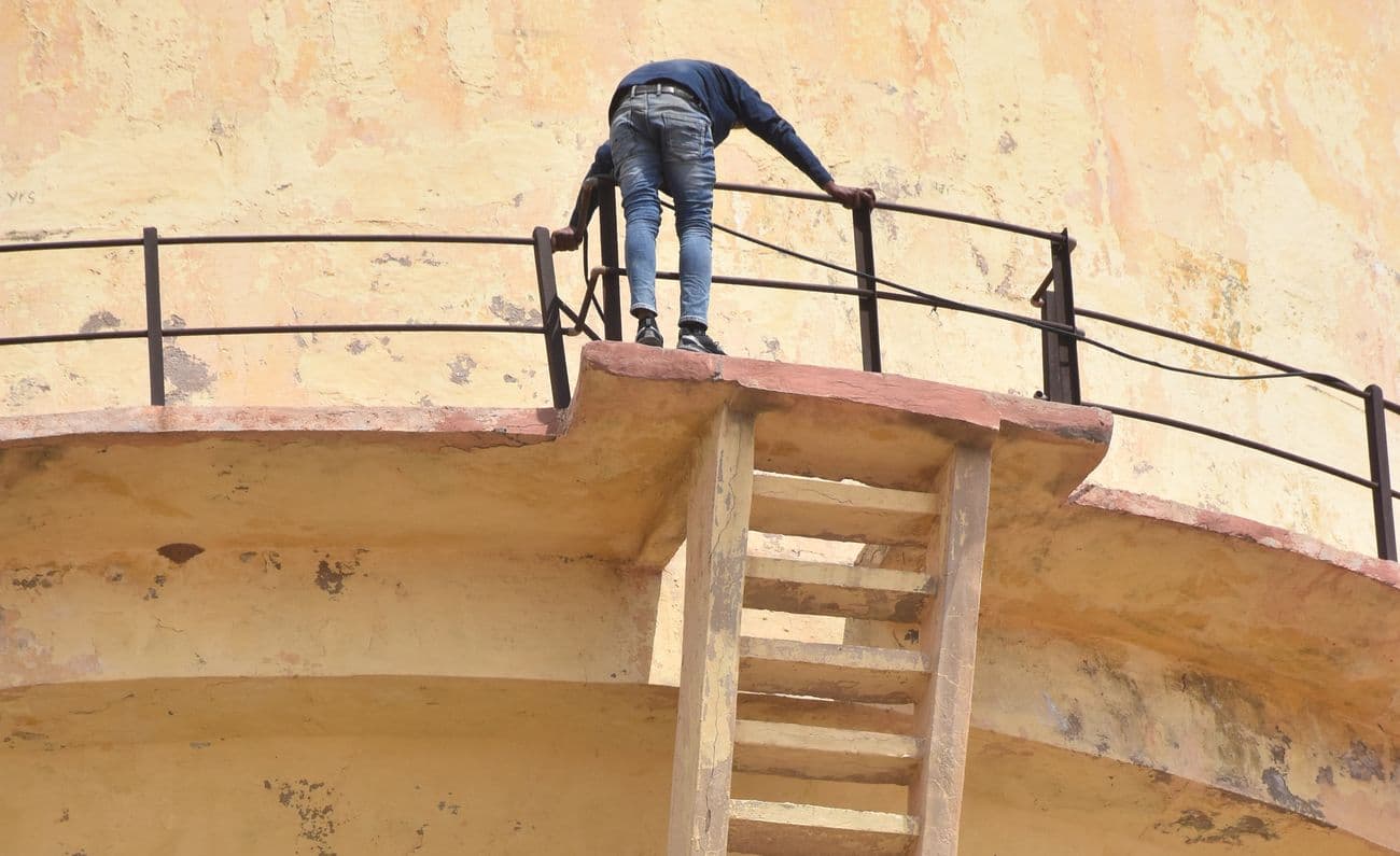 Angry over non-fulfillment of demands for punishment, job and compensation to those accused of son's murder.
 father climbed on the water tank